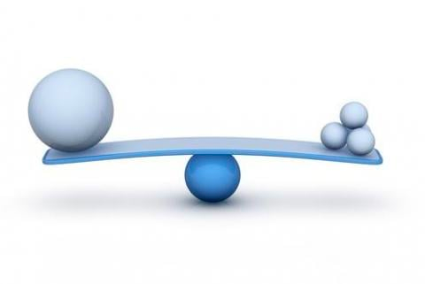 A scale showing one big vs several small